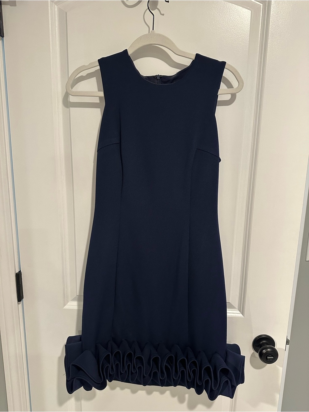 Elegant Navy Sleeveless Dress with Large Ruffle Hem